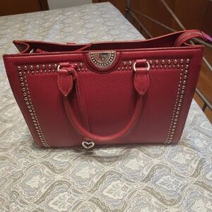 I'm selling this beautiful purse because I received a second one as a gift.